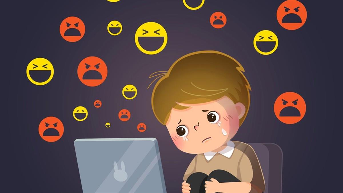 Illustrasjon som viser ein gut som har vonde følelsar foran ein skjerm. Rundt han er emojiar som ler og er sinte. - Klikk for stort bilete